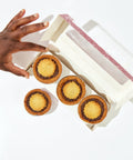 mince pies with hand reaching for it