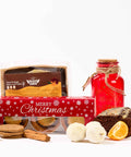 The No Guilt Bakes Christmas Keto Treat Box includes a variety of festive treats such as cookies and a jar.