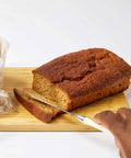 a carrot loaf being sliced