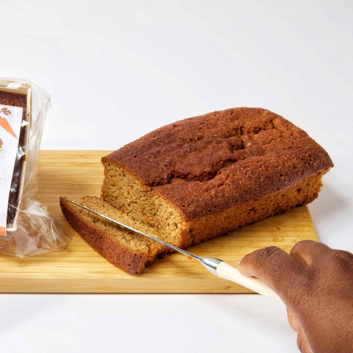 a carrot loaf being sliced